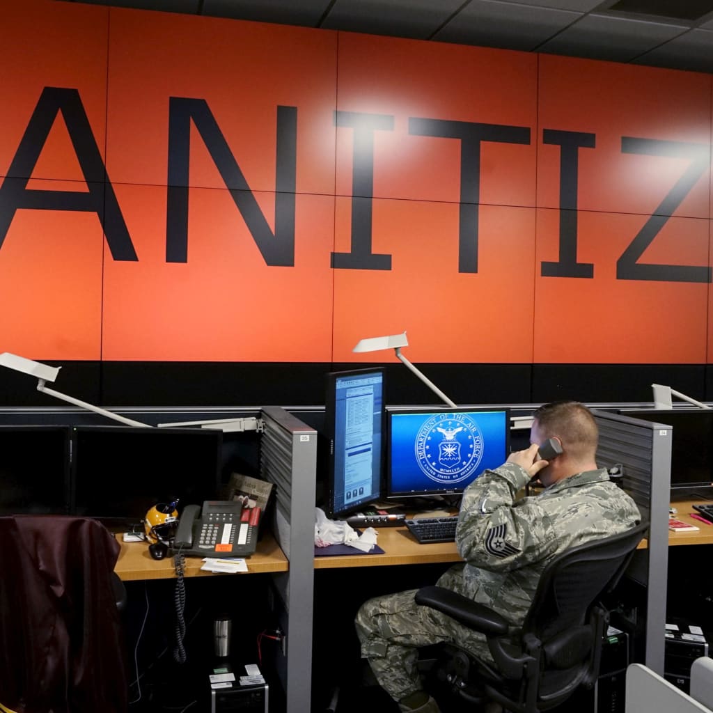 <p>A U.S. Air Force airman works under a data wall with screens blanked during a reporter’s visit at Petersen Air Force Base in Colorado Springs, Colorado.</p>
