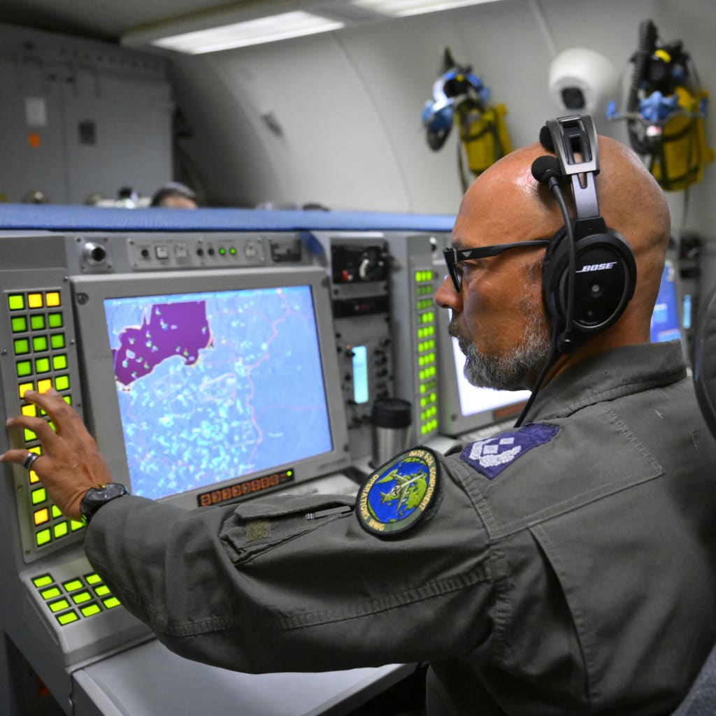 <p>A crew member looks at a map of Polish airspace near the Ukrainian border during a flight as part of NATO’s Eastern Sentry mission on September 19, 2025.</p>
