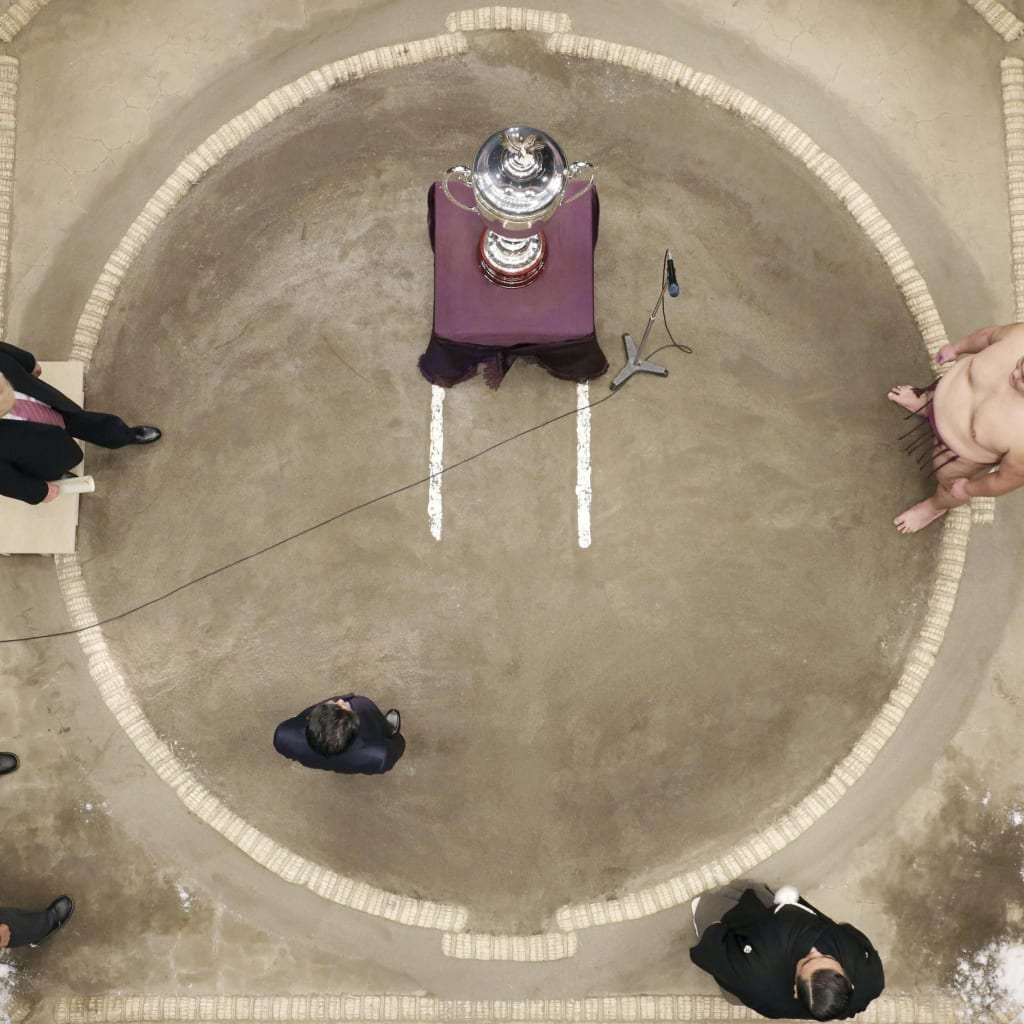 <p>U.S. President Donald J. Trump presents the President’s Cup at the Summer Grand Sumo Tournament in Tokyo.</p>
