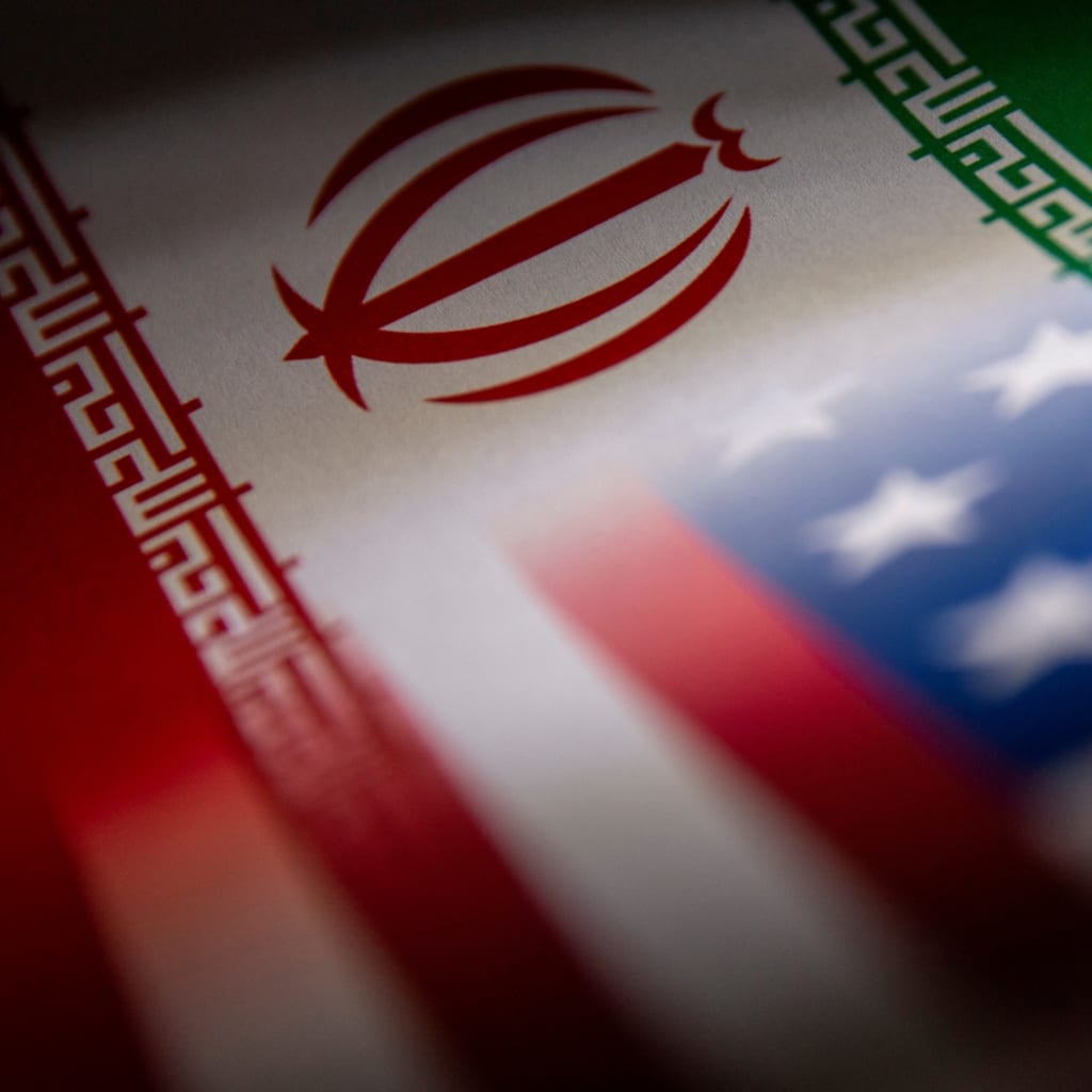 <p>The Iranian and U.S. flags illustrated.</p>
