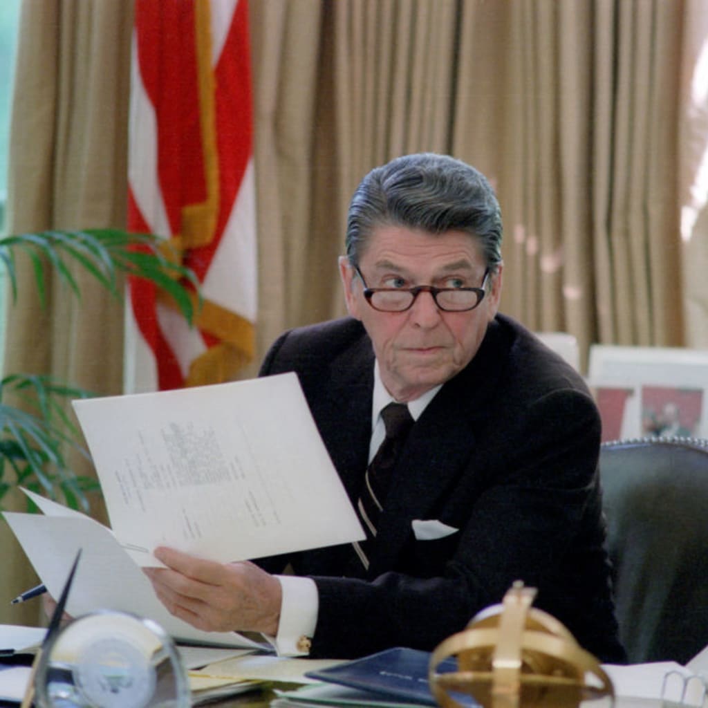 <p>President Ronald Reagan at his desk in the Oval Office in Washington, DC. HUM Images/Universal Images Group/Getty Images</p>
