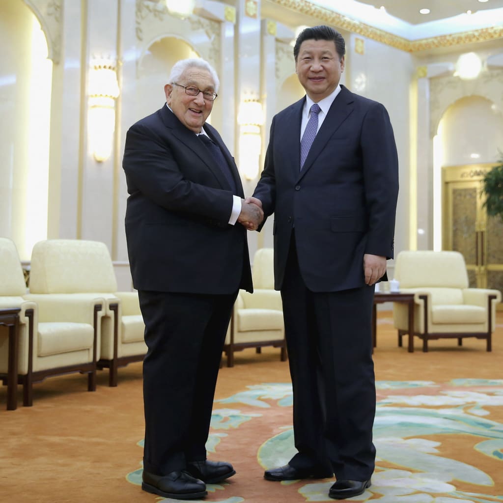 <p>Chinese President Xi Jinping shakes hands with former U.S. Secretary of State Henry Kissinger at the Great Hall of the People in Beijing.</p>
