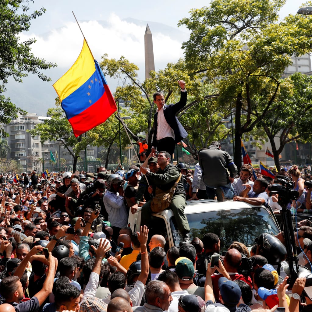 <p>Venezuelan opposition leader Juan Guaido protests in Caracas.</p>
