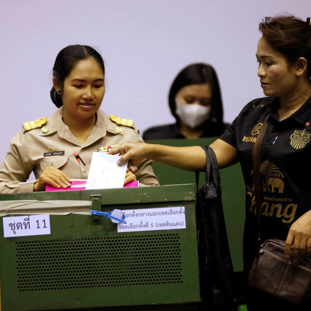 <p>A woman casts her early vote in Bangkok.</p>
