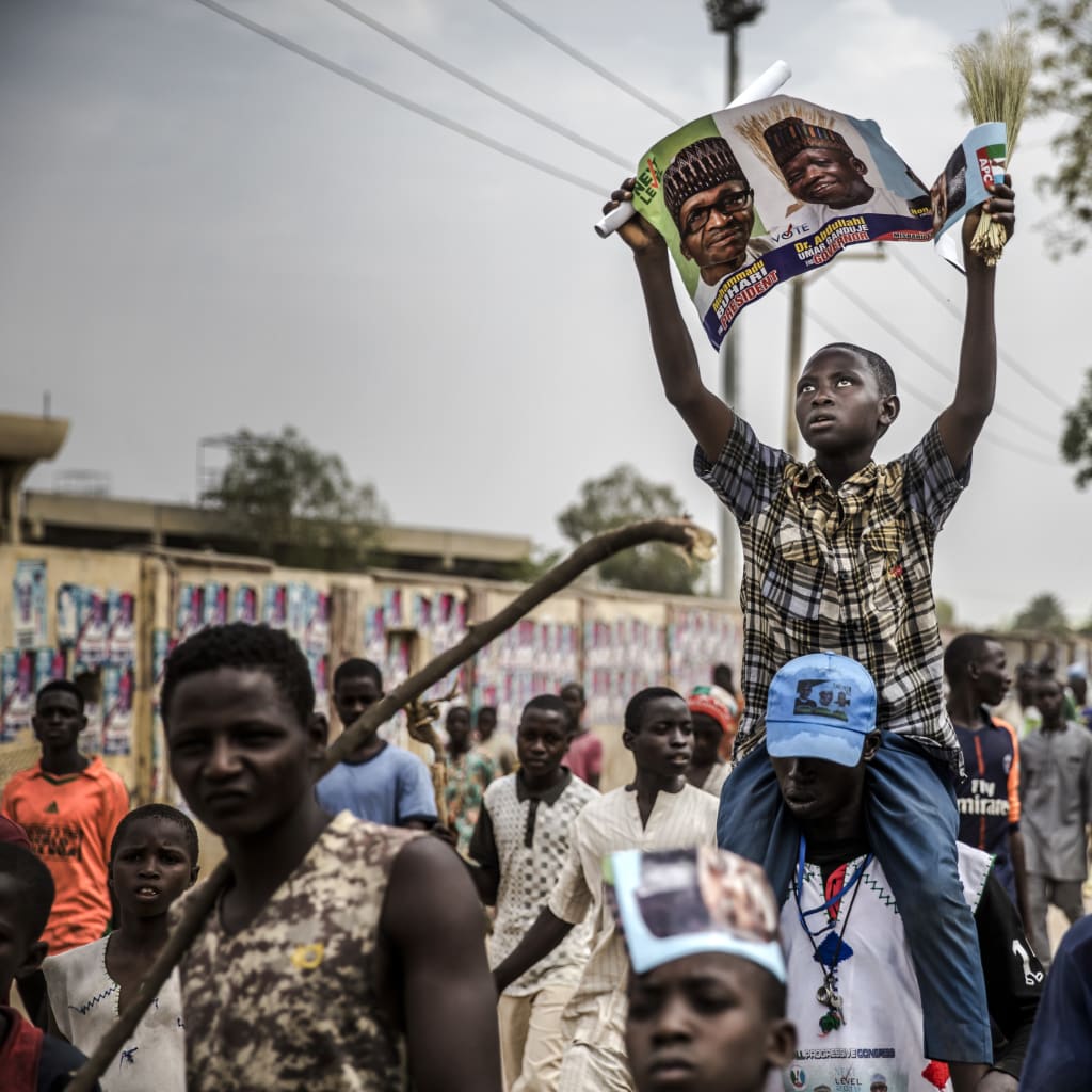 <p>Supporters of Nigerian President Muhammadu Buhari celebrate in Kano.</p>
