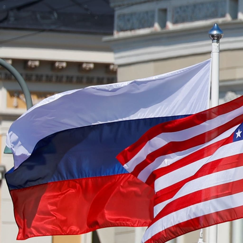 <p>U.S. and Russian flags are seen flying outside the Presidential Palace prior to President Trump and Russia’s President Vladimir Putin’s meeting in Helsinki.</p>