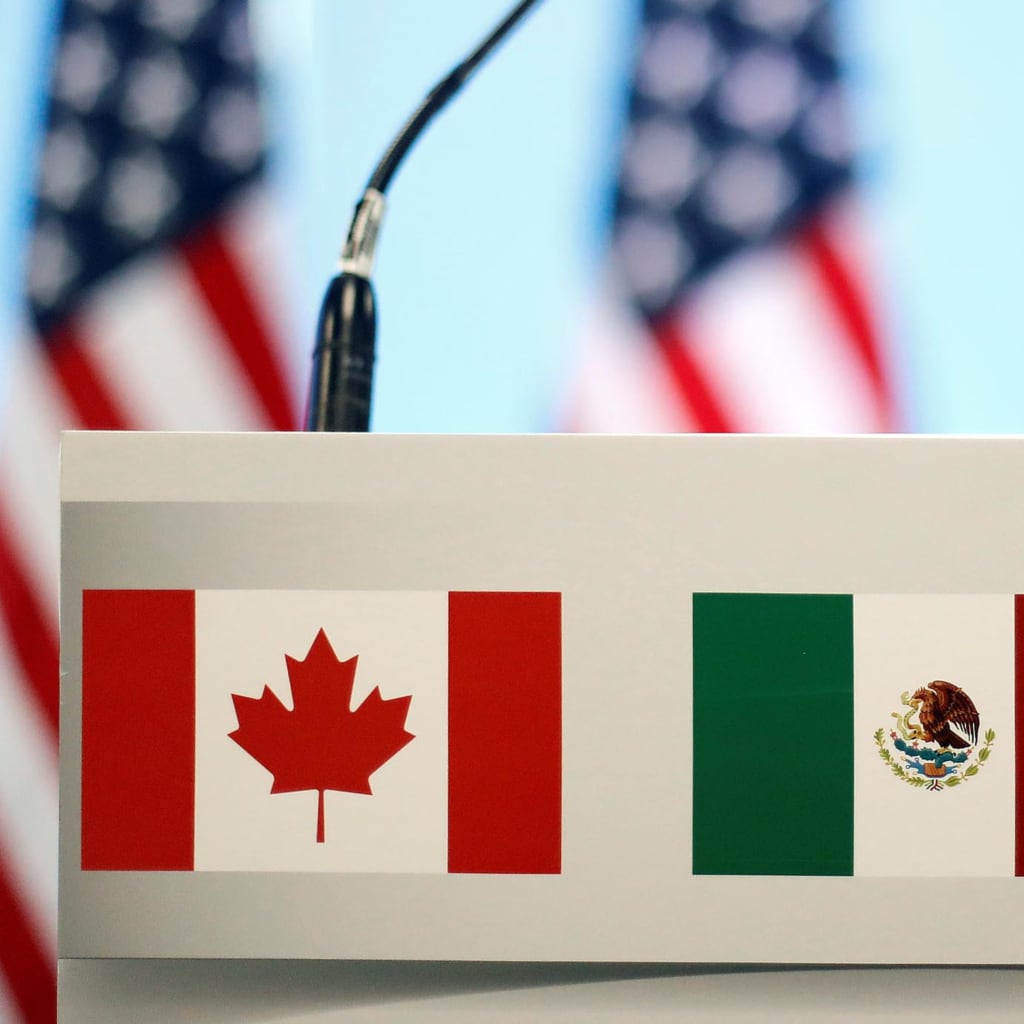 <p>The flags of Canada, Mexico, and the U.S. are seen on a lectern before a joint news conference on the closing of the seventh round of NAFTA talks in Mexico City, Mexico, March 5, 2018.</p>
