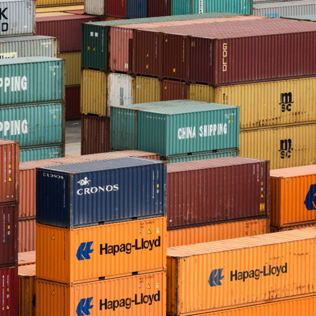 <p>Shipping containers being stacked in a cargo dock in Croatia.</p>
