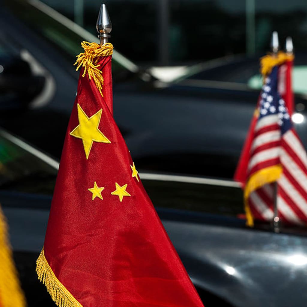 <p>U.S. and China national flags adorn the motorcade of U.S. Vice President Joe Biden during a diplomatic visit to Beijing, China in 2011.</p>
