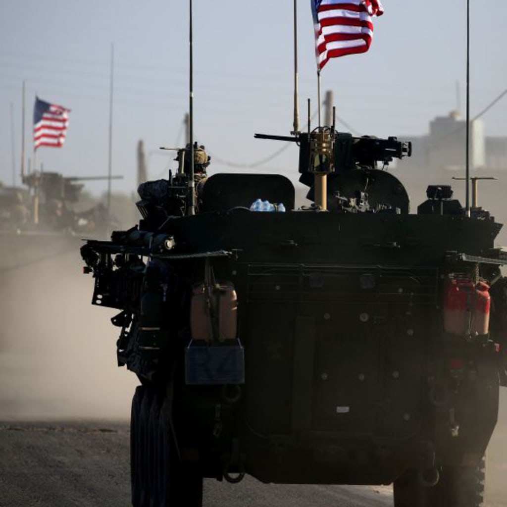 <p>A convoy of US forces armored vehicles on the western outskirts of the northern Syrian city of Manbij, on March 5, 2017.</p>
