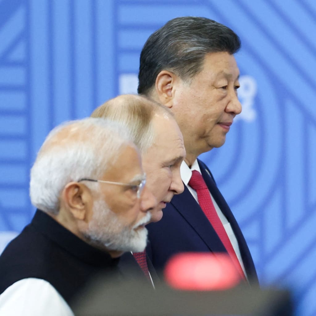 <p>Chinese President Xi Jinping, Russian President Vladimir Putin, and Indian Prime Minister Narendra Modi stand before a plenary session of the BRICS 2024 summit in Kazan, Russia, on October 23, 2024.</p>
