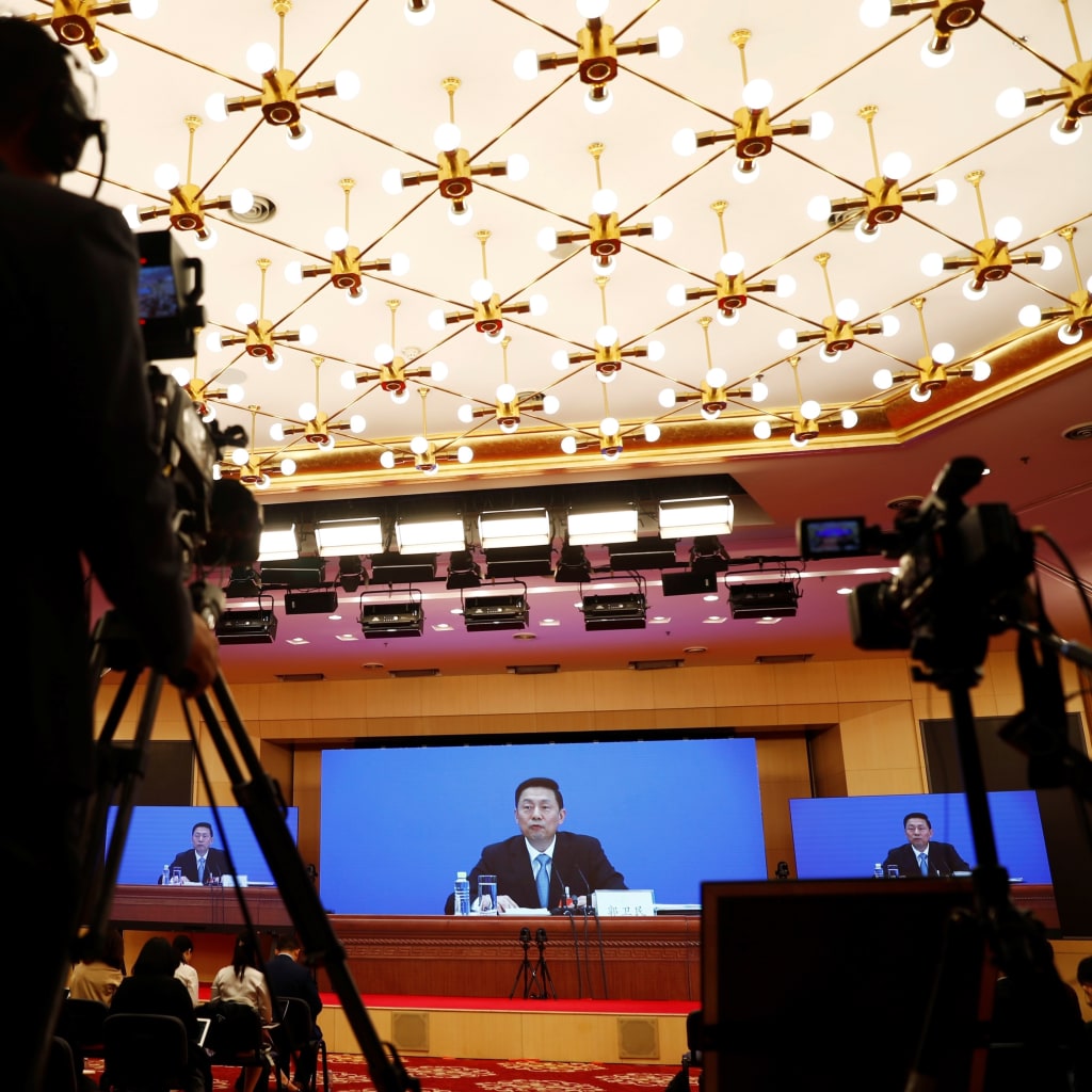 <p>Journalists attend a news conference held by Guo Weimin, spokesman for the National Committee of the Chinese People’s Political Consultative Conference in Beijing on May 20, 2020. </p>
