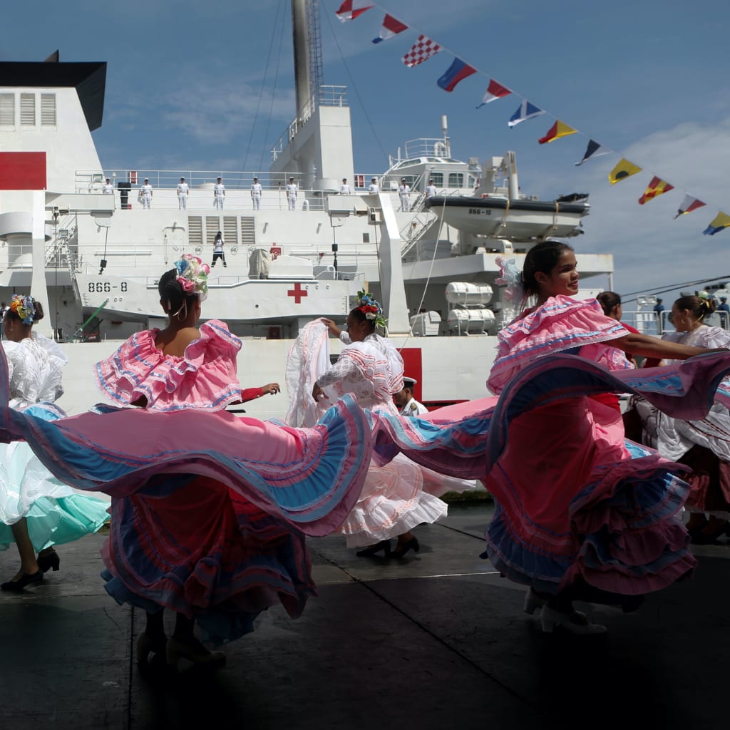 <p>Members of the Chinese People Liberation Army Navy stand at the China’s People’s Liberation Army (PLA) Navy hospital ship Peace Ark, during its arrival ceremony at the port in Venezuela on September 22, 2018.</p>
