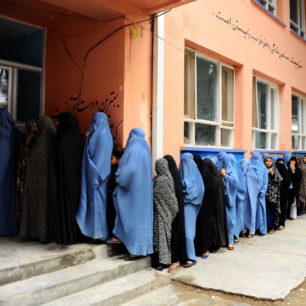 <p>Afghan women line up to vote in the 2014 presidential election.</p>
