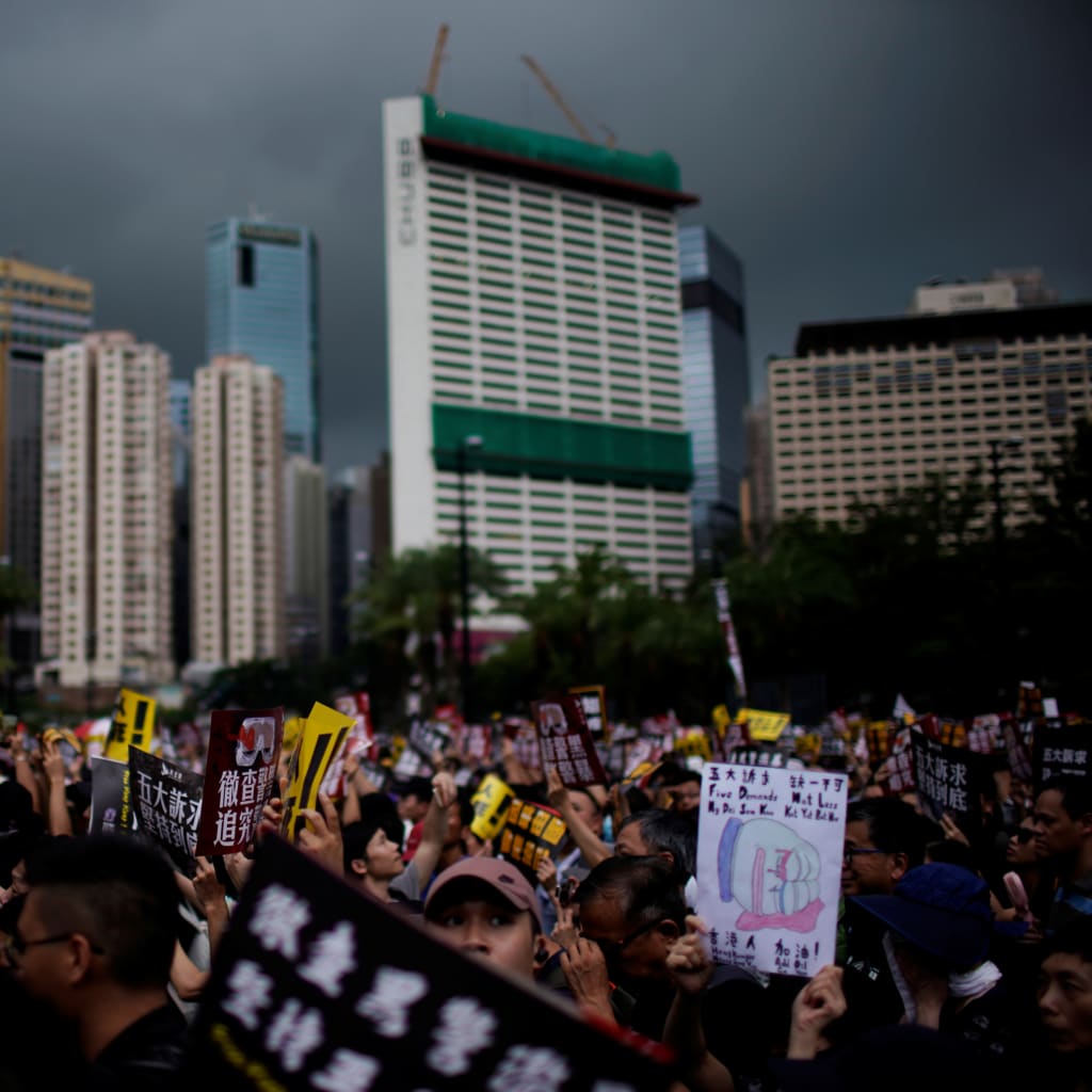 <p>Anti-extradition bill protesters march to demand democracy and political reforms, in Hong Kong on August 18, 2019.</p>
