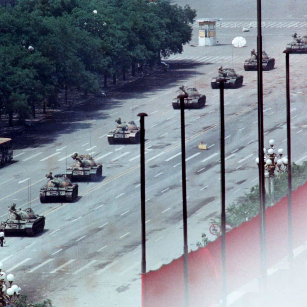 <p>A Beijing man stands in front of tanks on the Avenue of Eternal Peace.</p>
