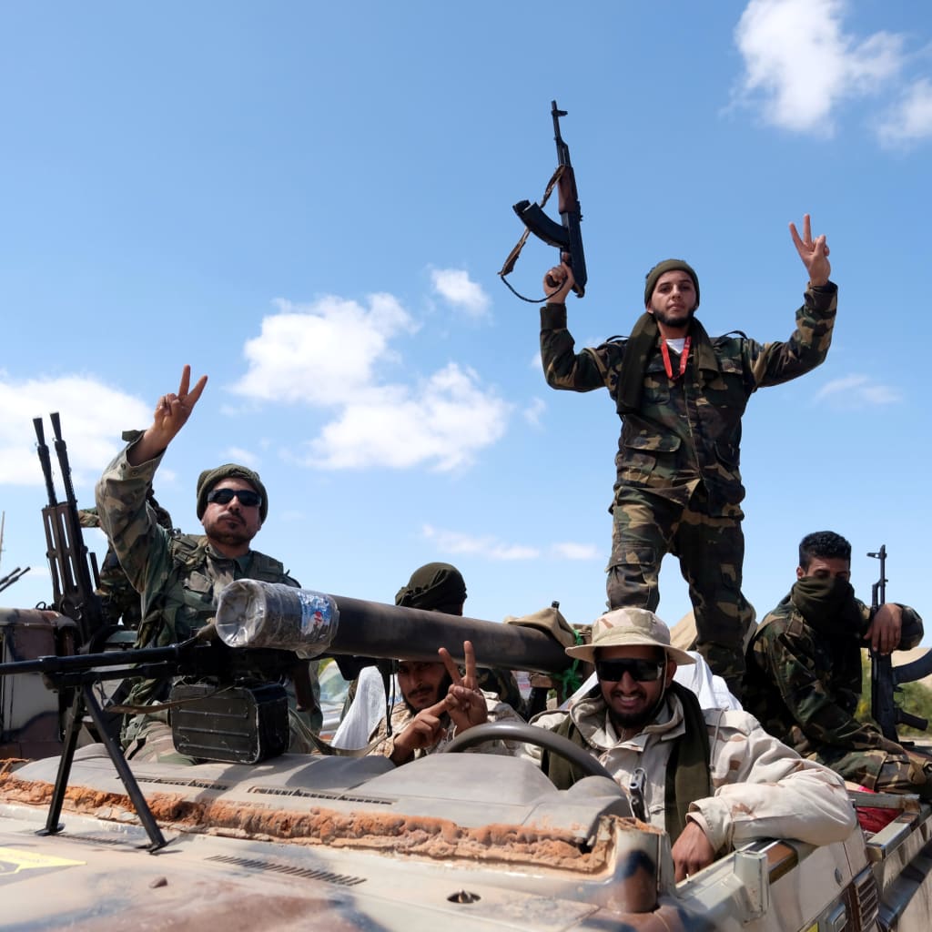 <p>Libyan National Army members, commanded by Khalifa Haftar, pose for a picture.</p>
