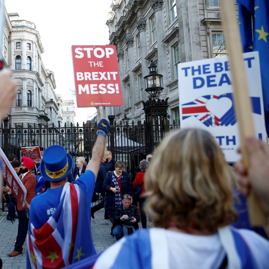 <p>Anti-Brexit protesters shout outside Downing Street in London.</p>
