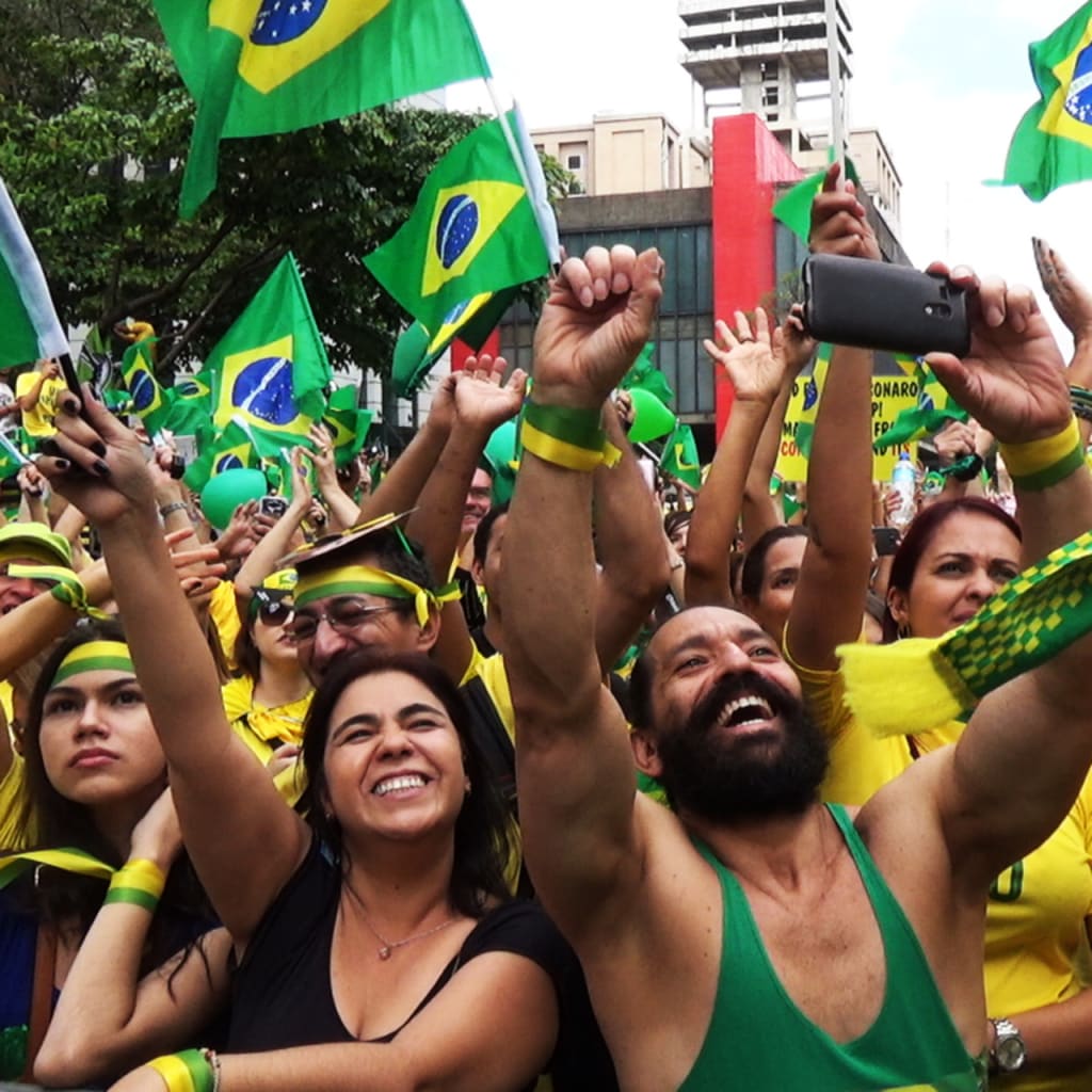 <p>Supporters of far-right presidential candidate, Jair Bolsonaro, attend a demonstration in Sao Paulo, Brazil, on October 24, 2018. </p>
