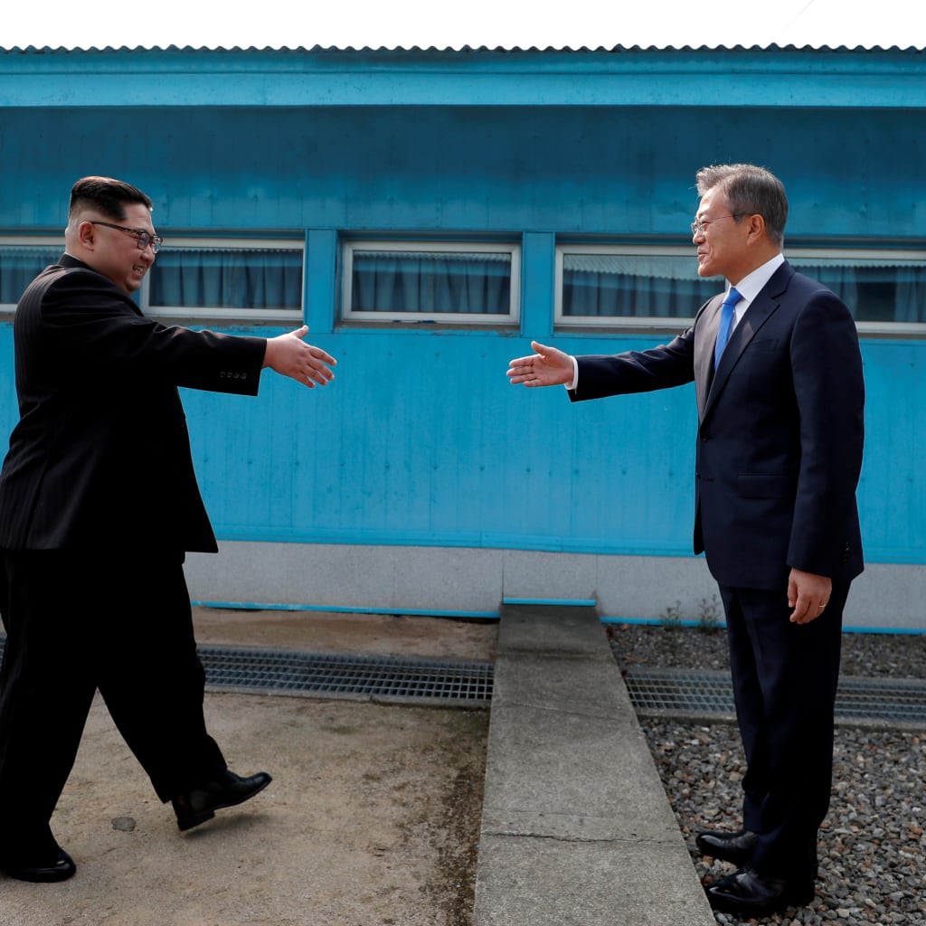 <p>South Korean President Moon Jae-in and North Korean leader Kim Jong Un shake hands at inside the demilitarized zone separating the two Koreas, April 27, 2018.</p>