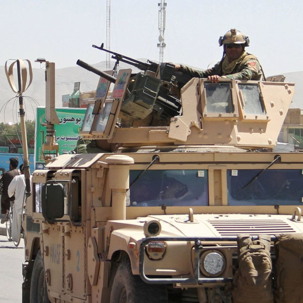 <p>An Afghan security forces convoy patrol after a Taliban attack in Ghazni city, Afghanistan.</p>
