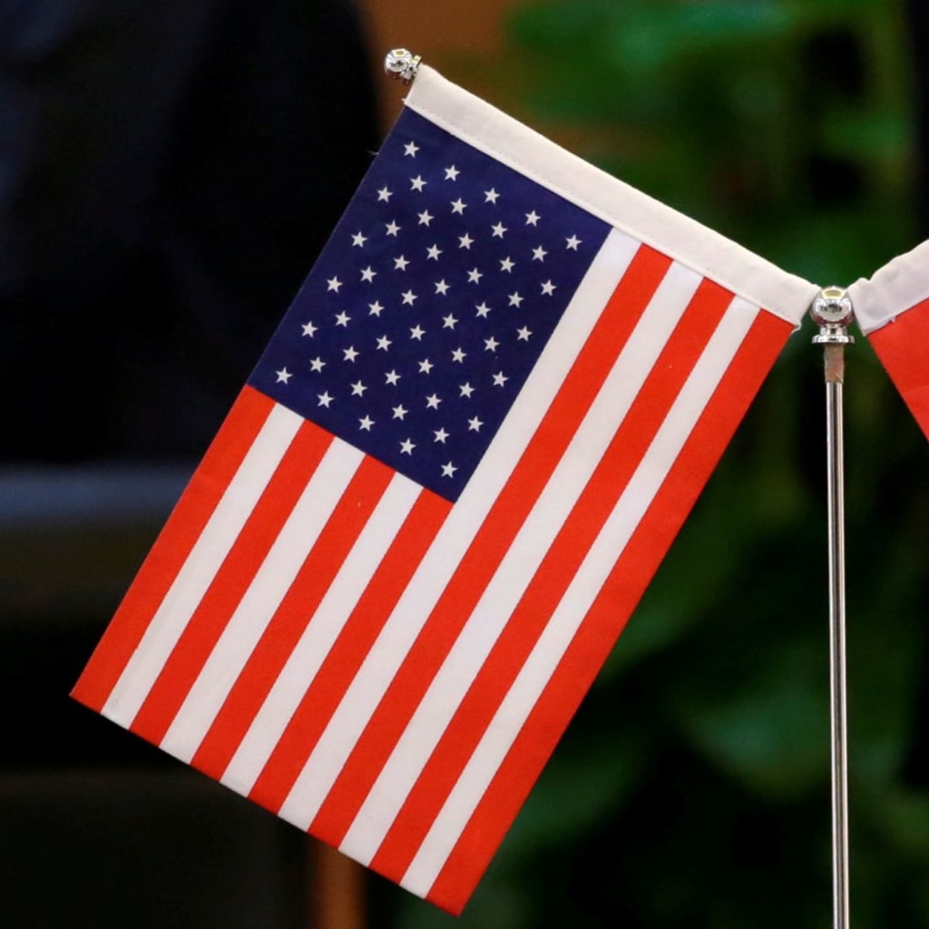 <p>Chinese and U.S. flags are set up for a signing ceremony at China’s Ministry of Transport in Beijing.</p>
