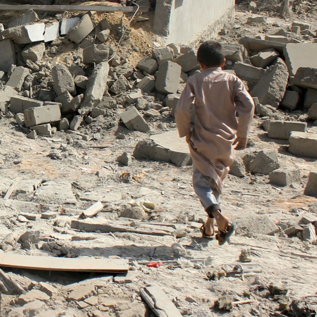 <p>Child at the site of an air strike in Saada, Yemen.</p>
