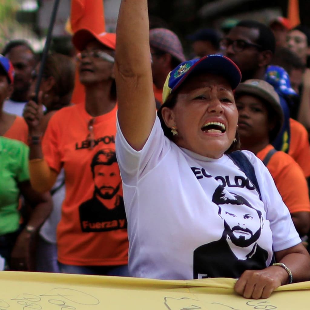 <p>A woman protests against upcoming presidential elections in Caracas, Venezuela.</p>

