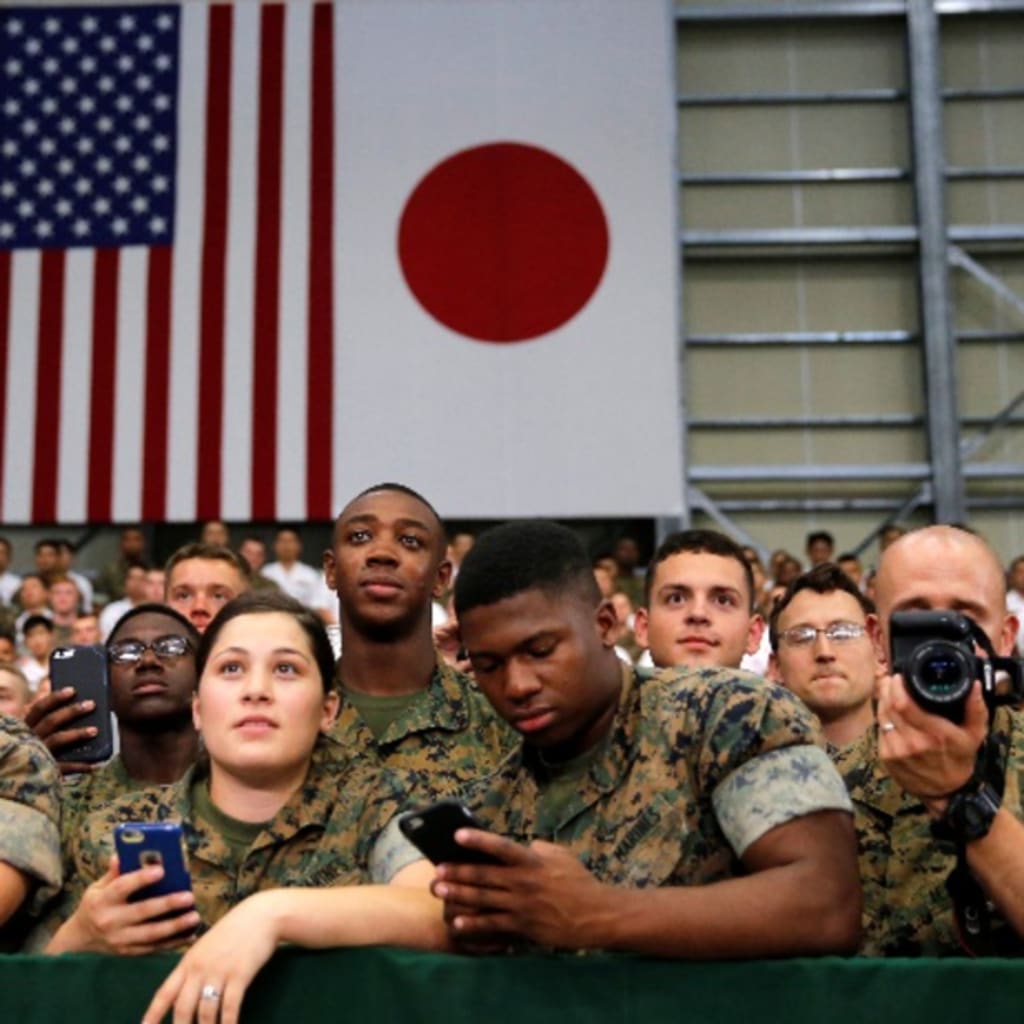 <p>U.S. and Japan Self-Defence Force’s soldiers listen a speech by U.S. President Barack Obama during his visits at Iwakuni Marine Corps Air Station, enroute to Hiroshima, Japan May 27, 2016. REUTERS/Carlos Barria</p>
