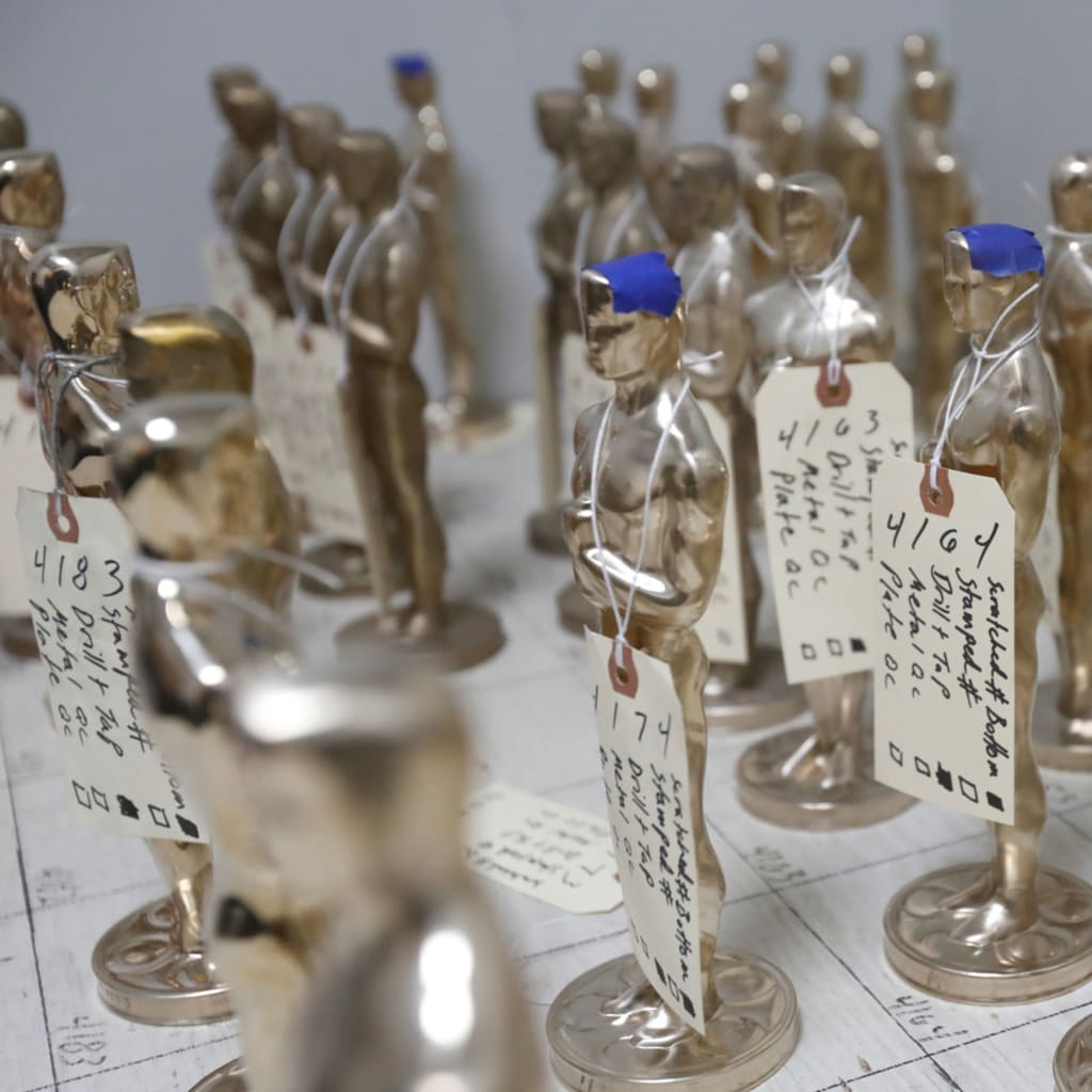 <p>Oscar statuettes in production leading up to the Academy Awards. </p>