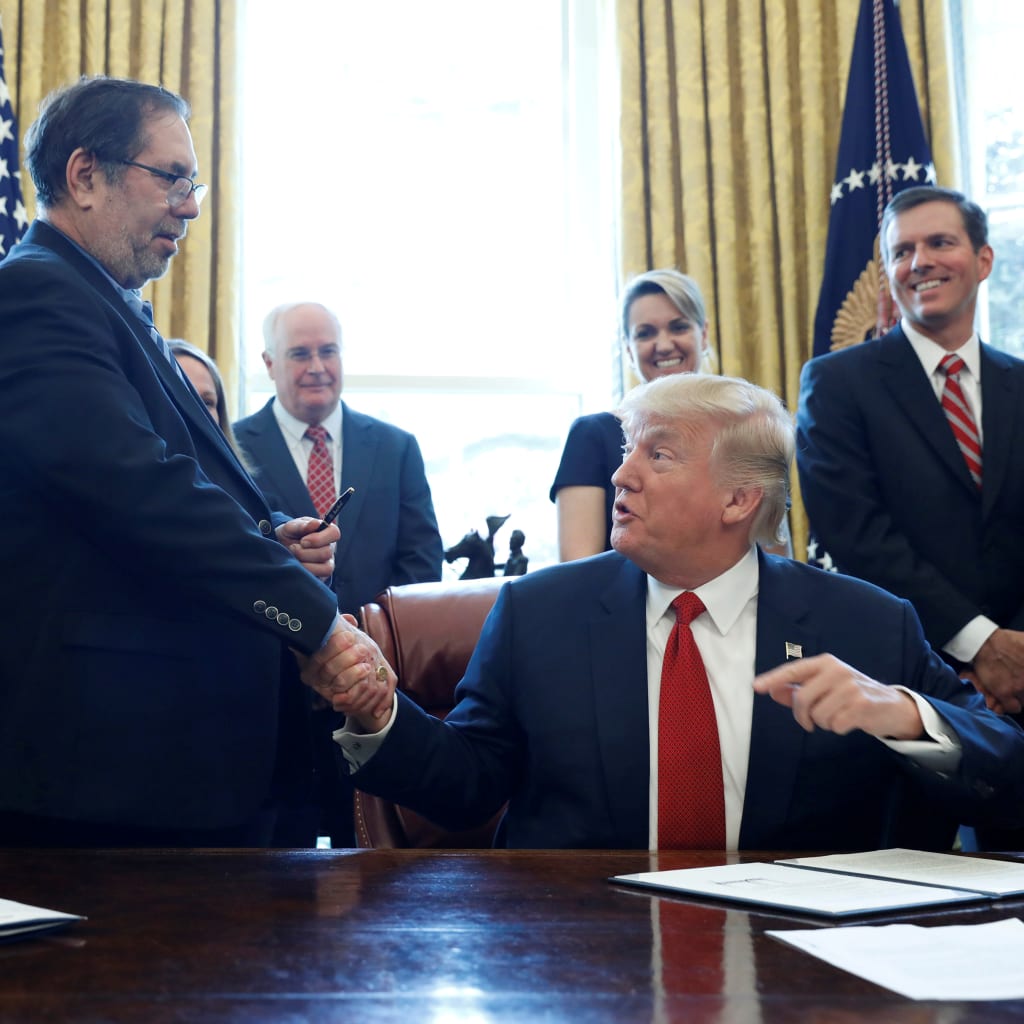 <p>President Donald Trump hands Leo Gerard, president of the United Steelworkers, his pen after signing a directive ordering an investigation into the impact of foreign steel on the U.S. economy.</p>