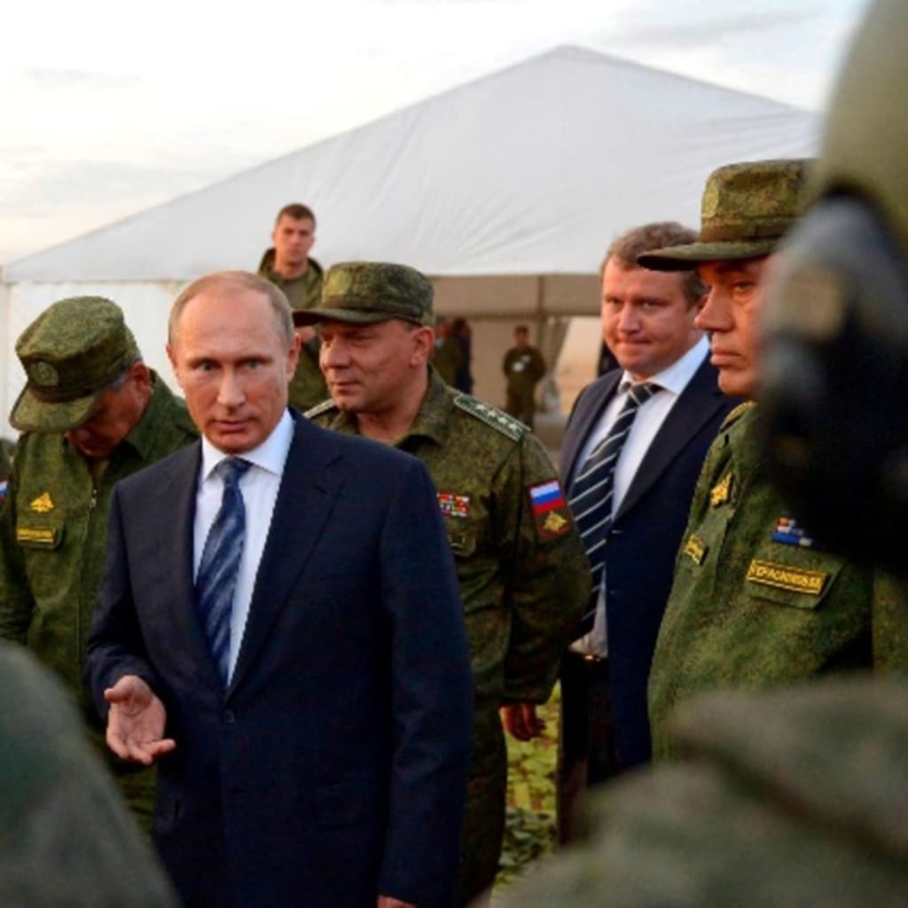 <p>Russian President Vladimir Putin talks to servicemen during a training exercise at the Donguz testing range in Orenburg region, Russia, September 19, 2015</p>
