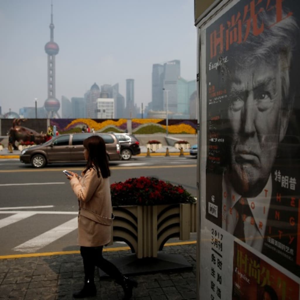 <p>A Chinese magazine poster showing U.S. President Donald Trump is displayed at a newsstand in Shanghai, China on March 21, 2017. U.S. and Chinese citizens are anticipating a summit between Donald Trump and Xi Jinping this week.</p>
