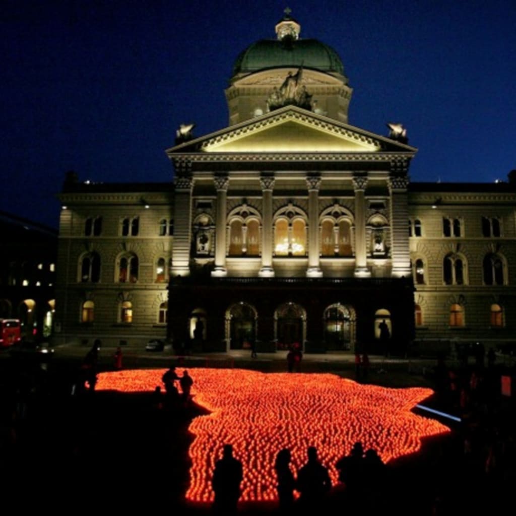 <p>Volunteers set up eight thousand candles in the shape of the African continent as part of a demonstration entitled “Africa needs medicine now” at the parliament square in Berne, Switzerland December 1, 2005. </p>