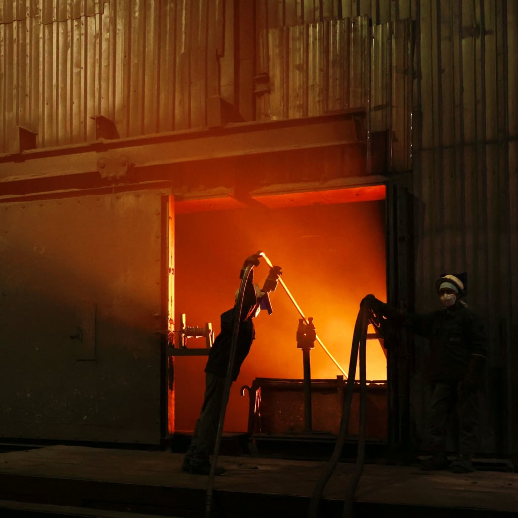 <p>Employees work at a furnace on a steel production line at the Jindal Stainless facility in Hisar, Haryana, India, May 30, 2025. </p>
