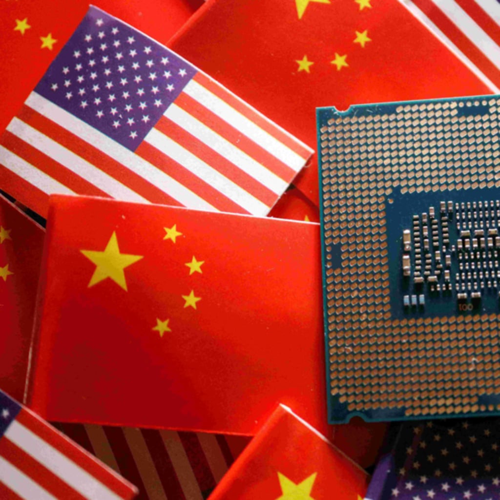 <p>A central processing unit semiconductor chip is displayed among flags of China and U.S., in this illustration picture taken February 17, 2023.</p>
