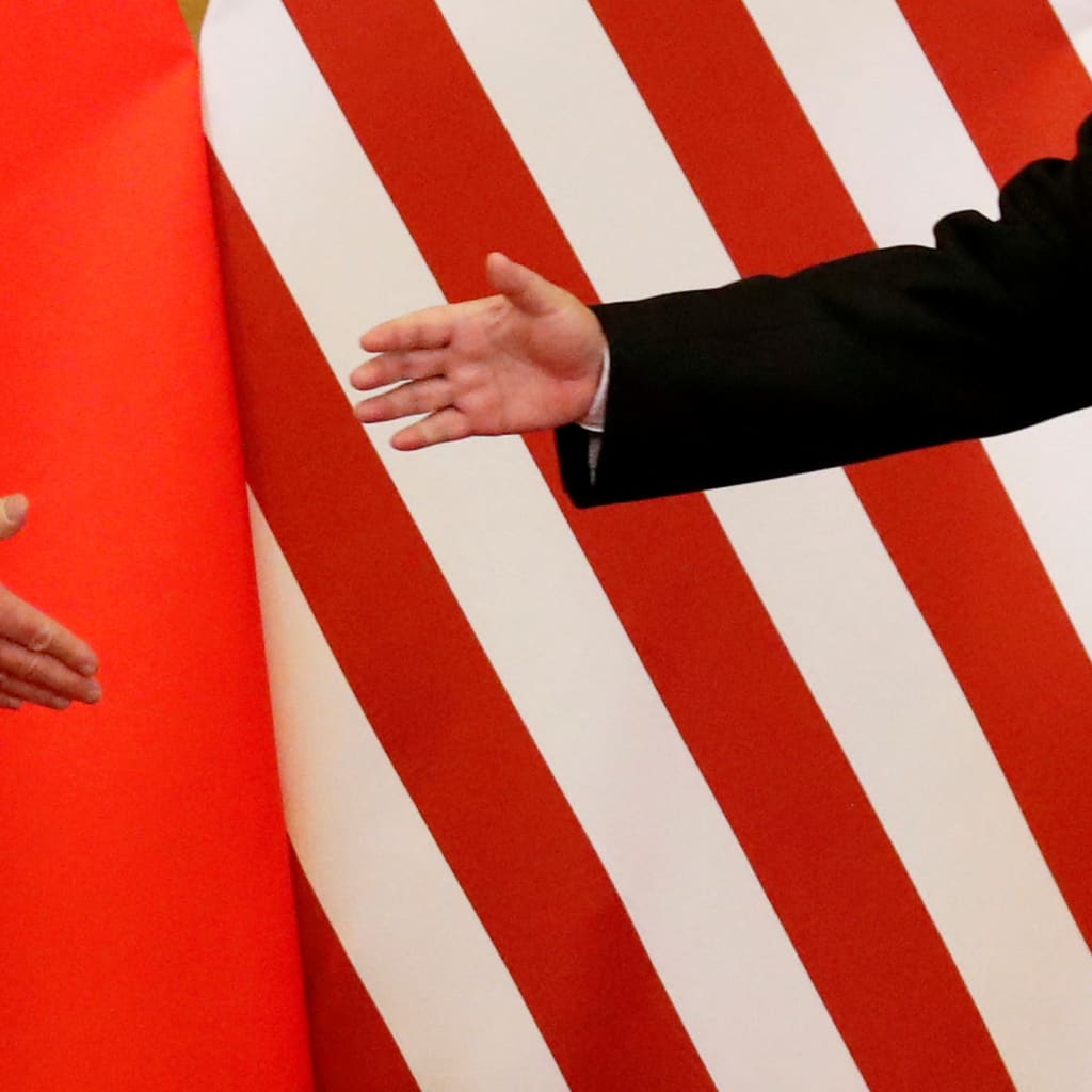 U.S. President Donald Trump and China's President Xi Jinping shake hands