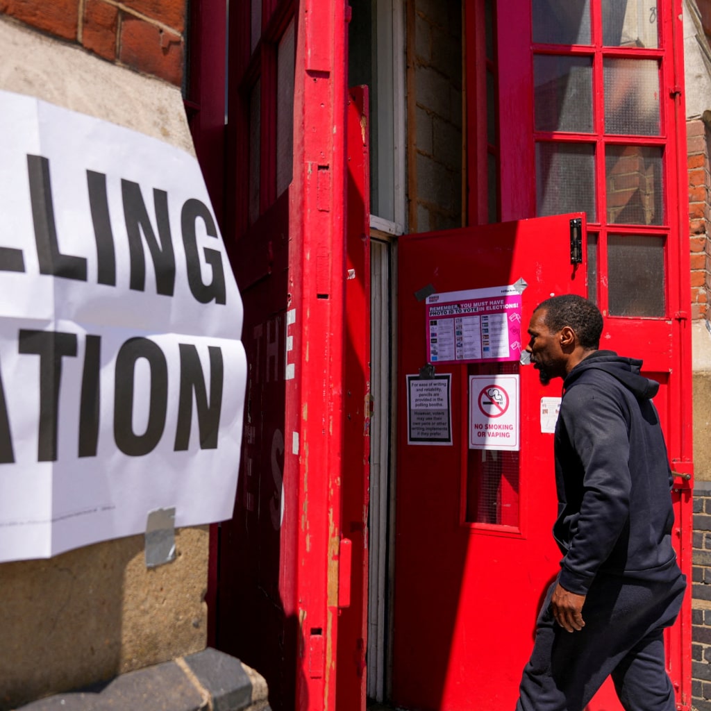 A man enters a polling station during the general election in London, Britain July 4, 2024.