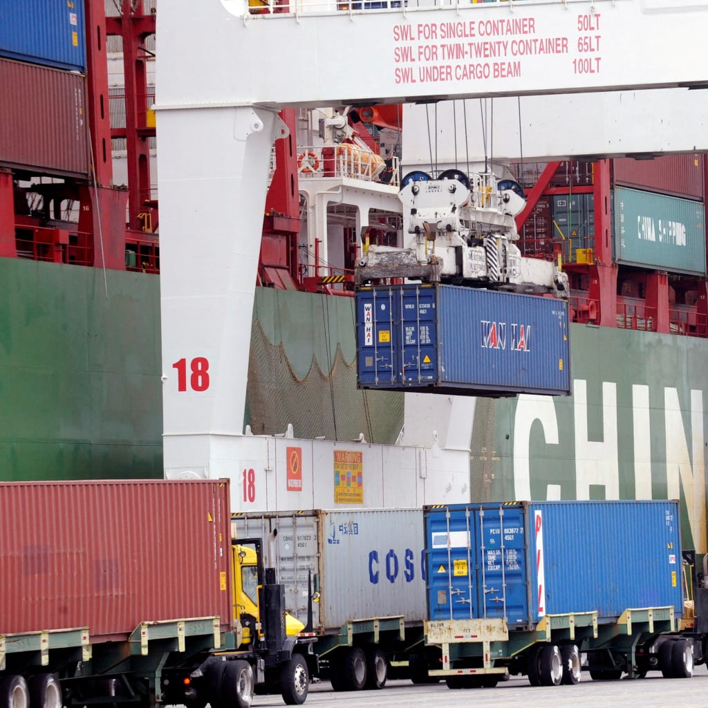 Shipping containers wait for processing