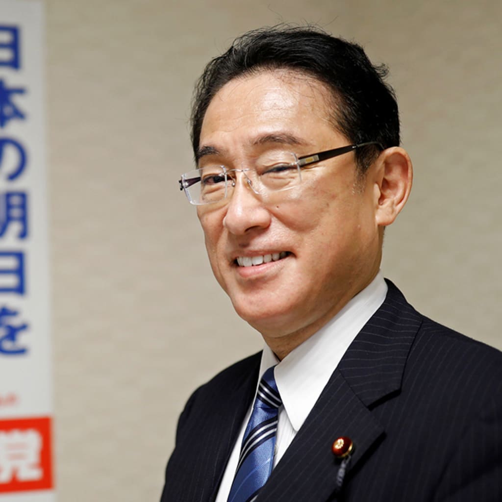 Kishida in front of Abe campaign poster