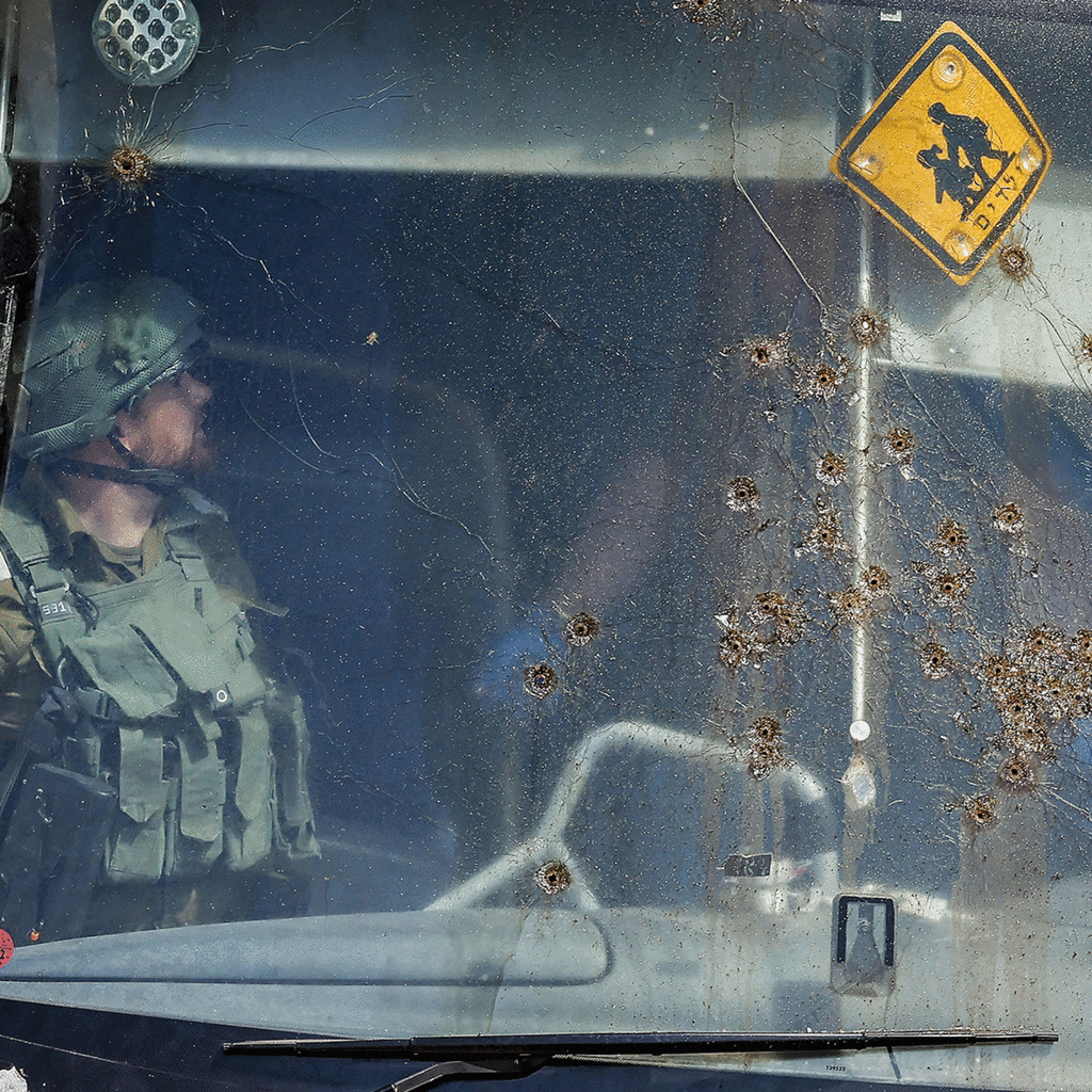 Members of Israeli security forces and emergency services inspect the site of a reported attack on an Israeli bus