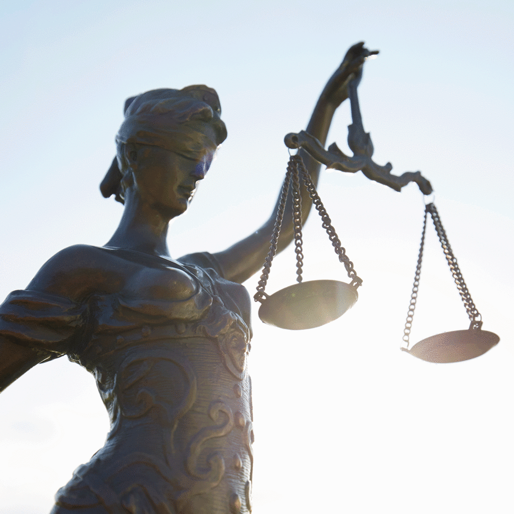 Lady Justice against clear sky