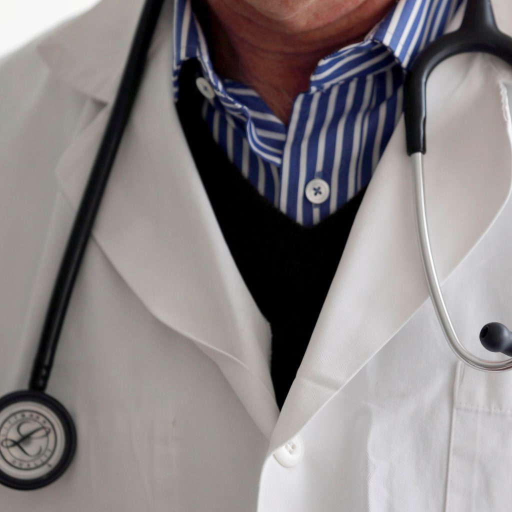 Doctor with stethoscope and white coat