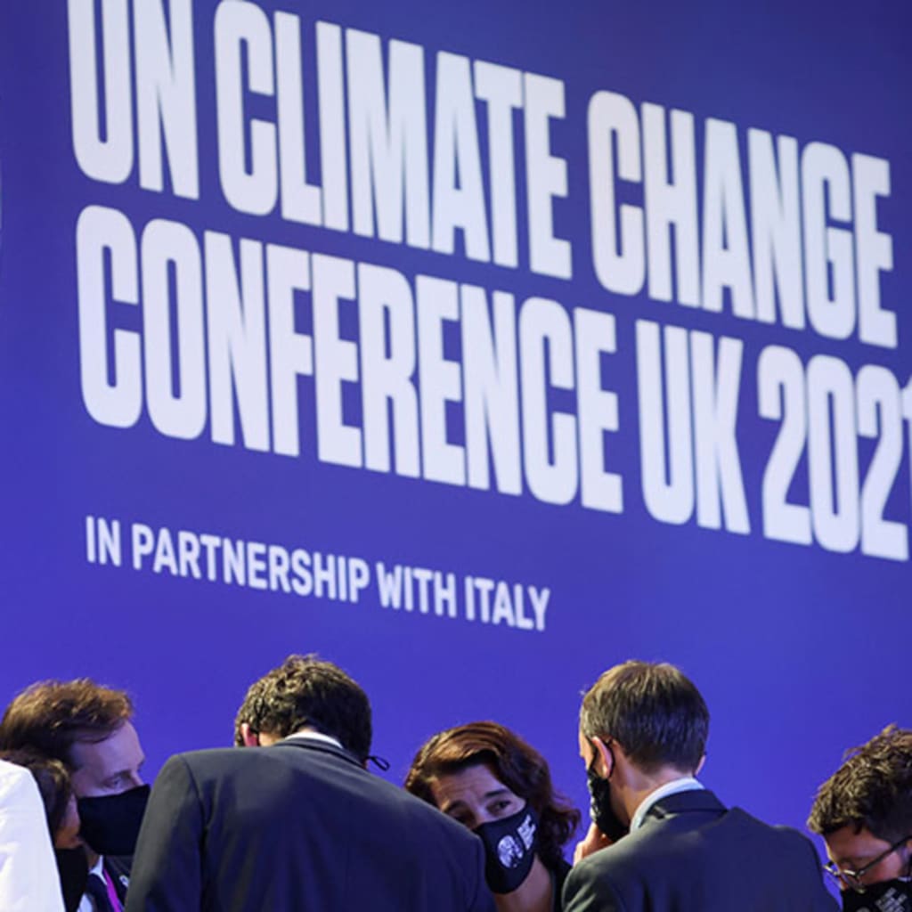 A discussion takes place during COP26