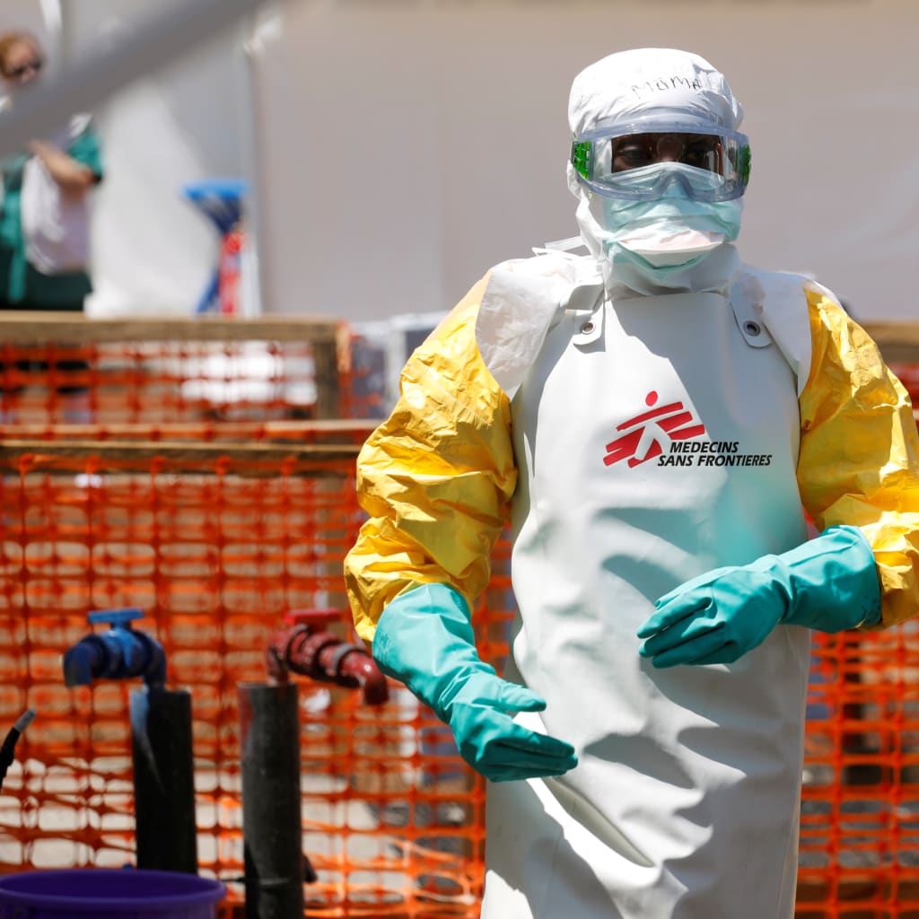 <p>[10:08 AM] Diana Schoder      A health worker disinfects an ambulance transporting a suspected Ebola patient to the Doctors Without Borders Ebola treatment center in Goma, Democratic Republic of Congo. Baz Ratner/Reuters [Ebola Health Worker.jpg] (https:/</p>
