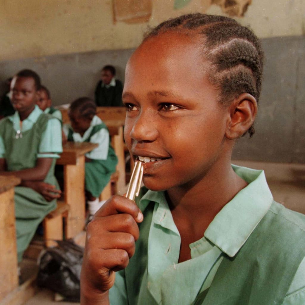 Jedidah Nkadayo, a 12 year old Maasai girl who was rescued from marriage, listens to her teacher at a boarding school in Kajiado, Kenya on January 13, 1999.