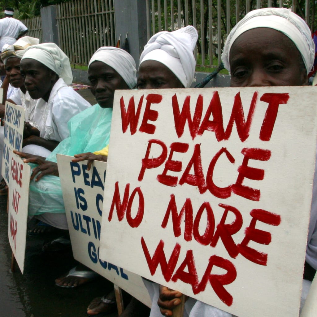 <p>Women demonstrate in Monrovia during the inauguration of Gyude Bryant, Liberia’s new interim leader, October 14, 2003.</p>
