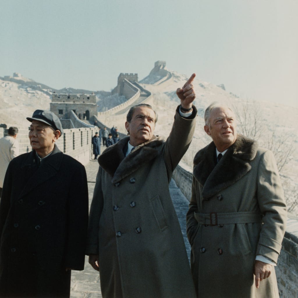 President Richard Nixon and Secretary of State William Rogers with Chinese Deputy Premier Li Xiannian during a visit to the Great Wall of China.