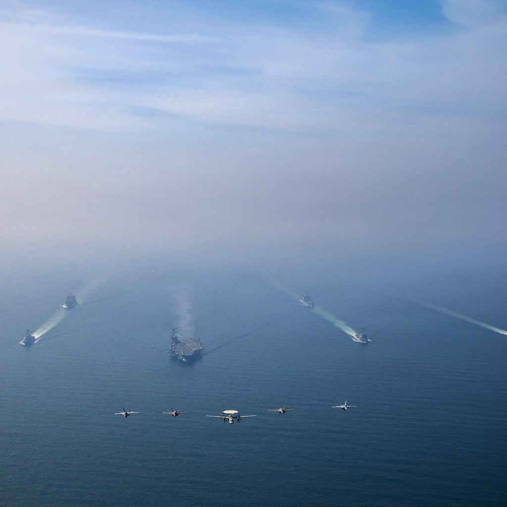 <p>The U.S. Navy’s Nimitz-class aircraft carrier USS <em>Abraham Lincoln</em> leads its strike group during a photo exercise in the Arabian Sea, February 6, 2026.</p>

