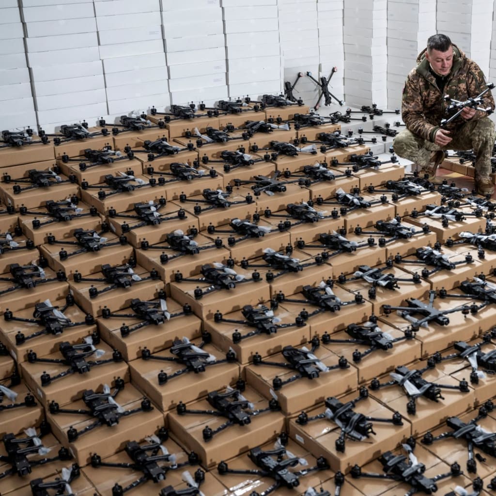 A Ukrainian serviceman inspects a first person view drone.